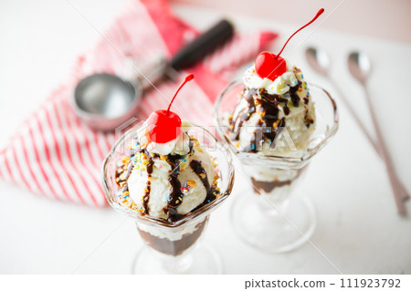 ice cream sundae with cherries and nuts ice cream sundae with cherries and nuts 111923792