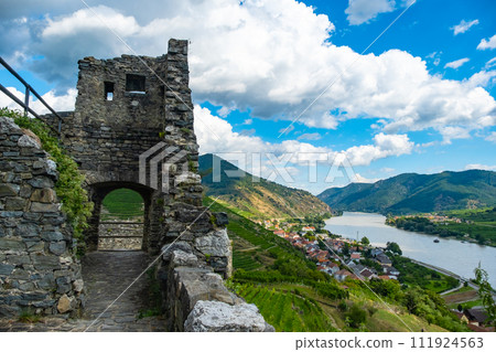 Panorama of Wachau valley with Danube river near Duernstein village in Lower Austria. Traditional wine and tourism region, Danube cruises. 111924563