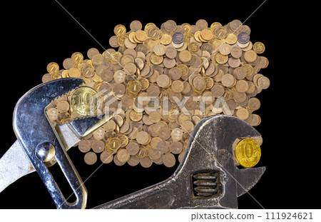 Allegory of the global financial crisis - Iron 10 rubles coin (written ten rubles, Bank of Russia in the Russian) in the grip of economic crisis, on a black background. Finance and business concept Allegory of the global financial crisis - Iron 10 rubles coin (written ten rubles, Bank of Russia in the Russian) in the grip of economic crisis, on a black background. Finance and business concept 111924621