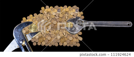 Allegory of the global financial crisis - Iron 10 rubles coin (written ten rubles, Bank of Russia in the Russian) in the grip of economic crisis, on a black background. Finance and business concept 111924624