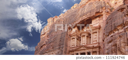 Al Khazneh or The Treasury (against the background of a beautiful sky with clouds). Petra, Jordan-- it is a symbol of Jordan, as well as Jordan's most-visited tourist attraction 111924746