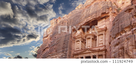 Al Khazneh or The Treasury (against the background of a beautiful sky with clouds). Petra, Jordan-- it is a symbol of Jordan, as well as Jordan's most-visited tourist attraction 111924749