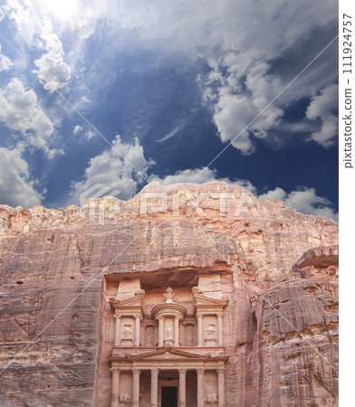 Al Khazneh or The Treasury (against the background of a beautiful sky with clouds). Petra, Jordan-- it is a symbol of Jordan, as well as Jordan's most-visited tourist attraction 111924757