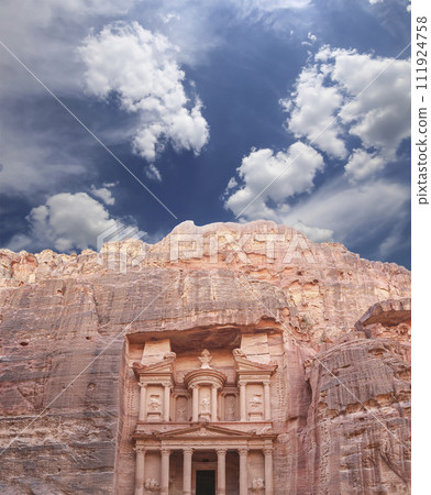 Al Khazneh or The Treasury (against the background of a beautiful sky with clouds). Petra, Jordan-- it is a symbol of Jordan, as well as Jordan's most-visited tourist attraction 111924758