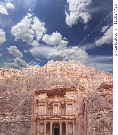 Al Khazneh or The Treasury (against the background of a beautiful sky with clouds). Petra, Jordan-- it is a symbol of Jordan, as well as Jordan's most-visited tourist attraction Al Khazneh or The Treasury (against the background of a beautiful sky with clouds). Petra, Jordan-- it is a symbol of Jordan, as well as Jordan's most-visited tourist attraction 111924759