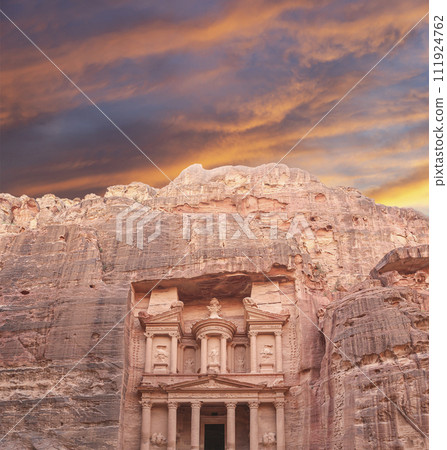 Al Khazneh or The Treasury (against the background of a beautiful sky with clouds). Petra, Jordan-- it is a symbol of Jordan, as well as Jordan's most-visited tourist attraction 111924762
