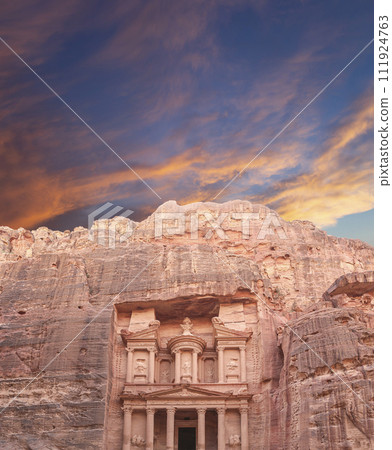 Al Khazneh or The Treasury (against the background of a beautiful sky with clouds). Petra, Jordan-- it is a symbol of Jordan, as well as Jordan's most-visited tourist attraction Al Khazneh or The Treasury (against the background of a beautiful sky with clouds). Petra, Jordan-- it is a symbol of Jordan, as well as Jordan's most-visited tourist attraction 111924763