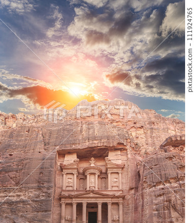 Al Khazneh or The Treasury (against the background of a beautiful sky with clouds). Petra, Jordan-- it is a symbol of Jordan, as well as Jordan's most-visited tourist attraction Al Khazneh or The Treasury (against the background of a beautiful sky with clouds). Petra, Jordan-- it is a symbol of Jordan, as well as Jordan's most-visited tourist attraction 111924765