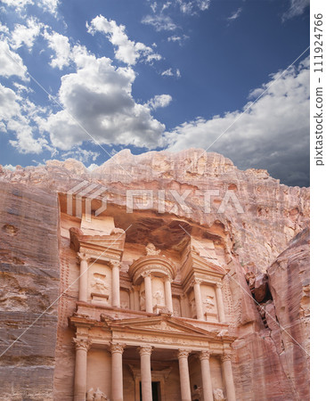 Al Khazneh or The Treasury (against the background of a beautiful sky with clouds). Petra, Jordan-- it is a symbol of Jordan, as well as Jordan's most-visited tourist attraction Al Khazneh or The Treasury (against the background of a beautiful sky with clouds). Petra, Jordan-- it is a symbol of Jordan, as well as Jordan's most-visited tourist attraction 111924766