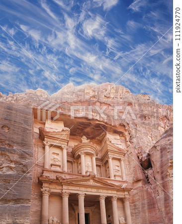 Al Khazneh or The Treasury (against the background of a beautiful sky with clouds). Petra, Jordan-- it is a symbol of Jordan, as well as Jordan's most-visited tourist attraction 111924770