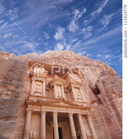 Al Khazneh or The Treasury (against the background of a beautiful sky with clouds). Petra, Jordan-- it is a symbol of Jordan, as well as Jordan's most-visited tourist attraction 111924778