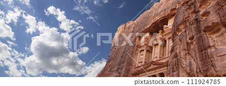 Al Khazneh or The Treasury (against the background of a beautiful sky with clouds). Petra, Jordan-- it is a symbol of Jordan, as well as Jordan's most-visited tourist attraction 111924785