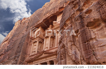 Al Khazneh or The Treasury (against the background of a beautiful sky with clouds). Petra, Jordan-- it is a symbol of Jordan, as well as Jordan's most-visited tourist attraction 111924818