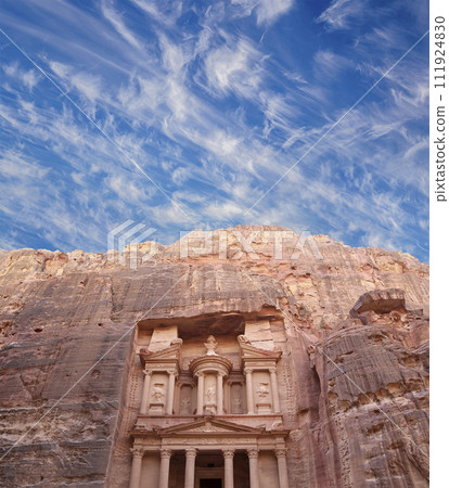 Al Khazneh or The Treasury (against the background of a beautiful sky with clouds). Petra, Jordan-- it is a symbol of Jordan, as well as Jordan's most-visited tourist attraction 111924830
