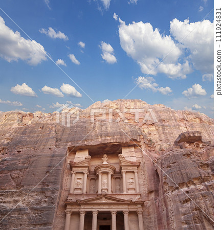 Al Khazneh or The Treasury (against the background of a beautiful sky with clouds). Petra, Jordan-- it is a symbol of Jordan, as well as Jordan's most-visited tourist attraction 111924831