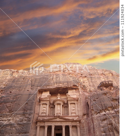 Al Khazneh or The Treasury (against the background of a beautiful sky with clouds). Petra, Jordan-- it is a symbol of Jordan, as well as Jordan's most-visited tourist attraction 111924834