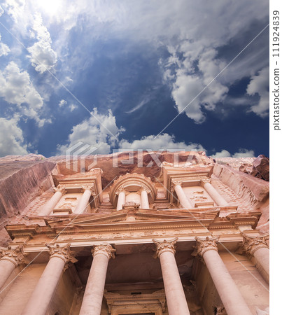 Al Khazneh or The Treasury (against the background of a beautiful sky with clouds). Petra, Jordan-- it is a symbol of Jordan, as well as Jordan's most-visited tourist attraction 111924839