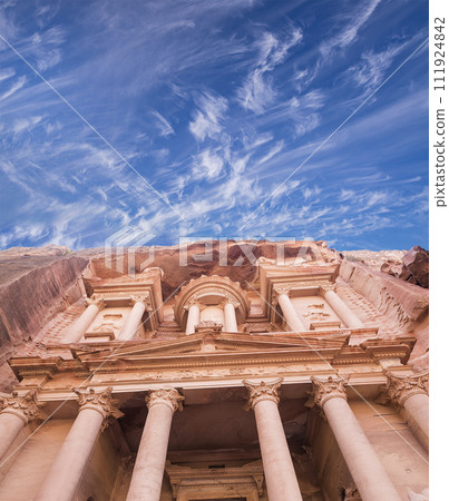 Al Khazneh or The Treasury (against the background of a beautiful sky with clouds). Petra, Jordan-- it is a symbol of Jordan, as well as Jordan's most-visited tourist attraction 111924842