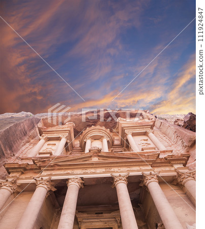 Al Khazneh or The Treasury (against the background of a beautiful sky with clouds). Petra, Jordan-- it is a symbol of Jordan, as well as Jordan's most-visited tourist attraction Al Khazneh or The Treasury (against the background of a beautiful sky with clouds). Petra, Jordan-- it is a symbol of Jordan, as well as Jordan's most-visited tourist attraction 111924847