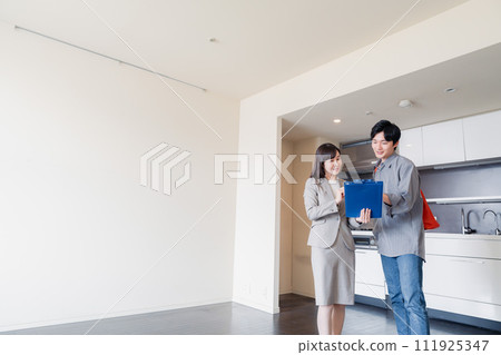A young man inspecting a rental house A young man inspecting a rental house 111925347