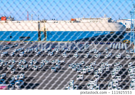 Japan's Yokohama cityscape The curse of the Japanese economy...Cars lined up at Daikoku Pier...The car carrier "ELEGANT ACE" in the back 111925553