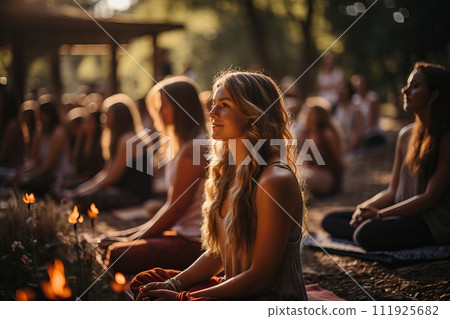 A group of girls do yoga on the street. 111925682