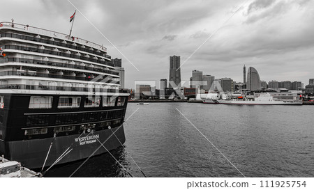 Luxury cruise ship calling at Yokohama's main pier and Minato Mirai Luxury cruise ship calling at Yokohama's main pier and Minato Mirai 111925754