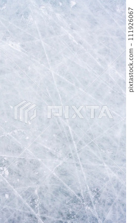 Ice background with marks from skating and hockey, blue texture of rink surface with scratches Ice background with marks from skating and hockey, blue texture of rink surface with scratches 111926067