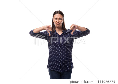 young caucasian fashionable brunette woman dressed in a dark blue blouse is feeling dissatisfied 111926275