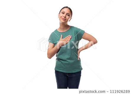 young friendly positive beautiful brunette lady with a ponytail hairstyle is dressed in a green t 111926289