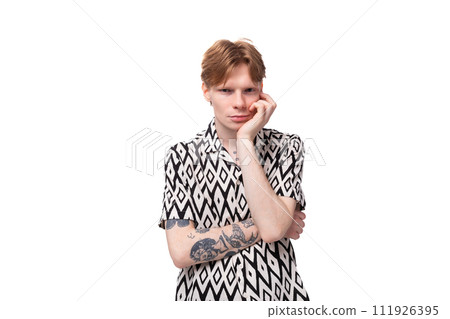 young red-haired caucasian man in short sleeve summer shirt is feeling sad 111926395