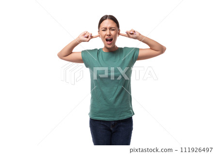 young brunette woman feels angry and closes her ears 111926497
