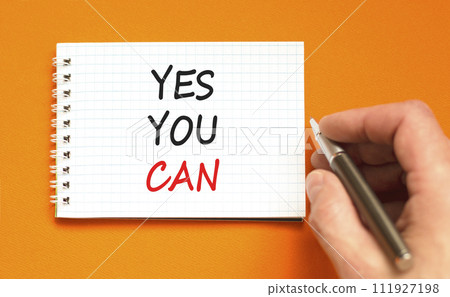 Motivational Yes you can symbol. Concept words Yes you can on beautiful white note. Beautiful orange background. Businessman hand. Business motivational and Yes you can concept. Copy space Motivational Yes you can symbol. Concept words Yes you can on beautiful white note. Beautiful orange background. Businessman hand. Business motivational and Yes you can concept. Copy space 111927198