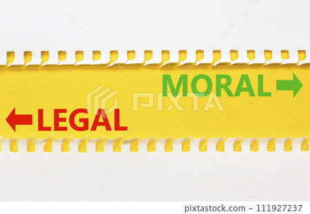 Moral or legal symbol. Concept word Moral or Legal on beautiful yellow paper. Beautiful white paper background. Business and moral or legal concept. Copy space. Moral or legal symbol. Concept word Moral or Legal on beautiful yellow paper. Beautiful white paper background. Business and moral or legal concept. Copy space. 111927237
