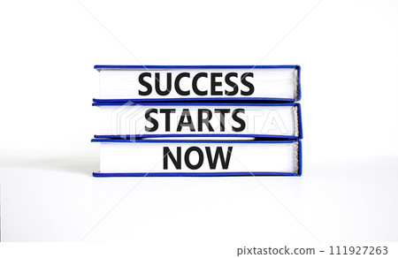 Success starts now symbol. Concept word Success starts now on beautiful books. Beautiful white table white background. Business motivational success starts now concept. Copy space. Success starts now symbol. Concept word Success starts now on beautiful books. Beautiful white table white background. Business motivational success starts now concept. Copy space. 111927263