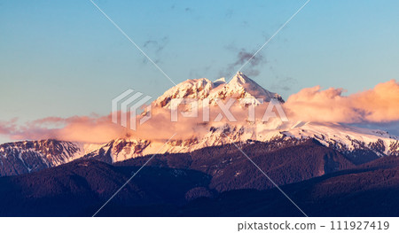 Snow Covered Canadian Rocky Mountain peaks. Sunny Cloudy Sunset 111927419
