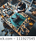 Engineer working on racing fpv drone combat kamikaze bomber in workshop. 111927545