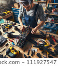 Engineer working on racing fpv drone combat kamikaze bomber in workshop. 111927547