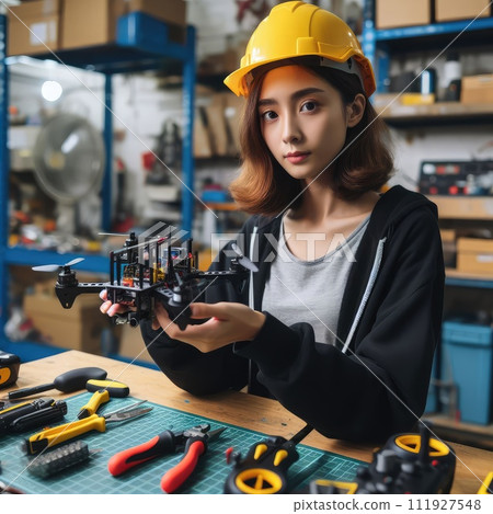 Engineer working on racing fpv drone combat kamikaze bomber in workshop. 111927548