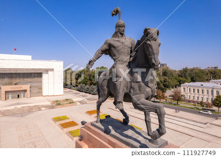 Aerial top view to Monument Epic Statue of Aykol Manas - kyrgyz hero on Ala-Too Square. State History Museum in downtown of Bishkek city. Central asia, Kyrgyzstan. 111927749