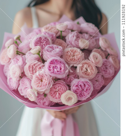 AI-generated content. A beautifull woman holding a bouquet of pink flowers AI-generated content. A beautifull woman holding a bouquet of pink flowers 111928192