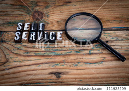 SELF SERVICE. Alphabet letters on wood texture background SELF SERVICE. Alphabet letters on wood texture background 111928209