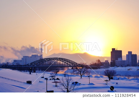Sunrise over Asahi Bridge and Daisetsuzan Mountain Range, Asahikawa City, Hokkaido 111928454