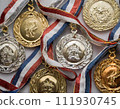 Background material with gold medals, silver medals, and bronze medals lined up 111930745