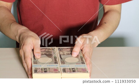 Close-up of a person with a lot of money 111933050