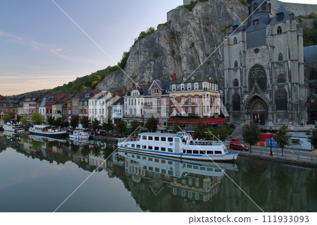 Early morning view along the Meuse River flowing through the center of Dinant, a city in Namur, Wallonia, Belgium, Western Europe 111933093