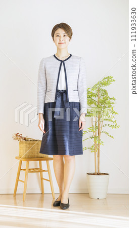Full body of a woman wearing a ceremony suit (fashion coordination) Full body of a woman wearing a ceremony suit (fashion coordination) 111933630