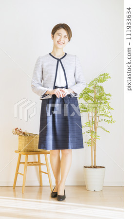 Full body of a woman wearing a ceremony suit (fashion coordination) 111933634