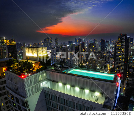 Rooftop pool with Bangkok skyline view at sunset, in Bangkok Thailand 111933868