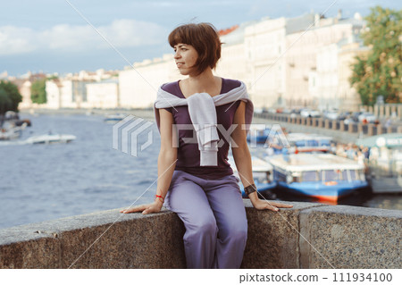 A girl in the city on a sunny day 111934100